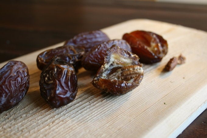 dates on a wooden cutting board