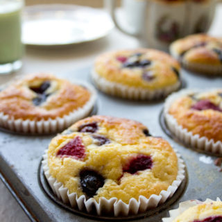 a muffin pan with almond flour blueberry muffins