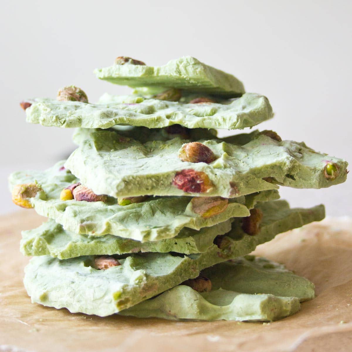 a stack of matcha frozen yogurt bark pieces