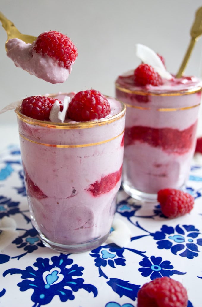taking a spoonful out of a glass with raspberry fool