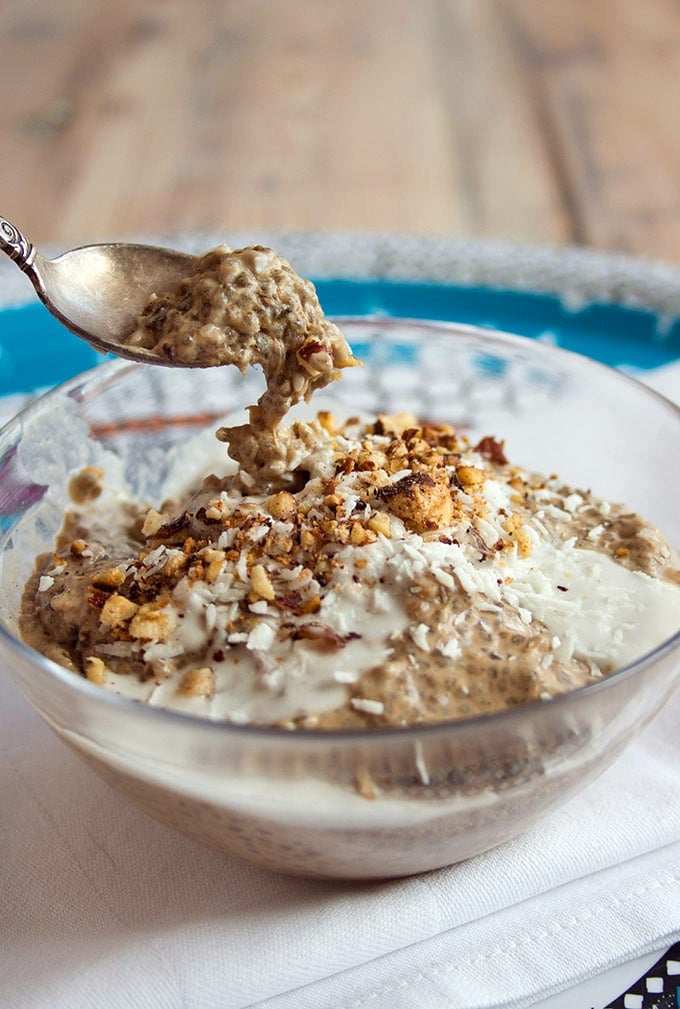 closeup of a spoon taking coffee chia pudding out of a bowl