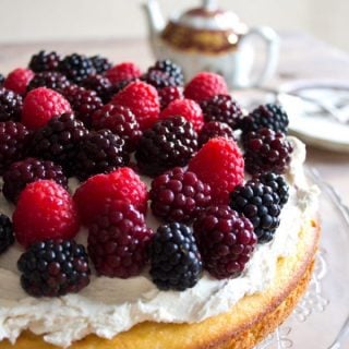 an almond flour cake topped with mascarpone and berries