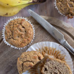 a low carb chocolate banana muffin cut in half and a knife