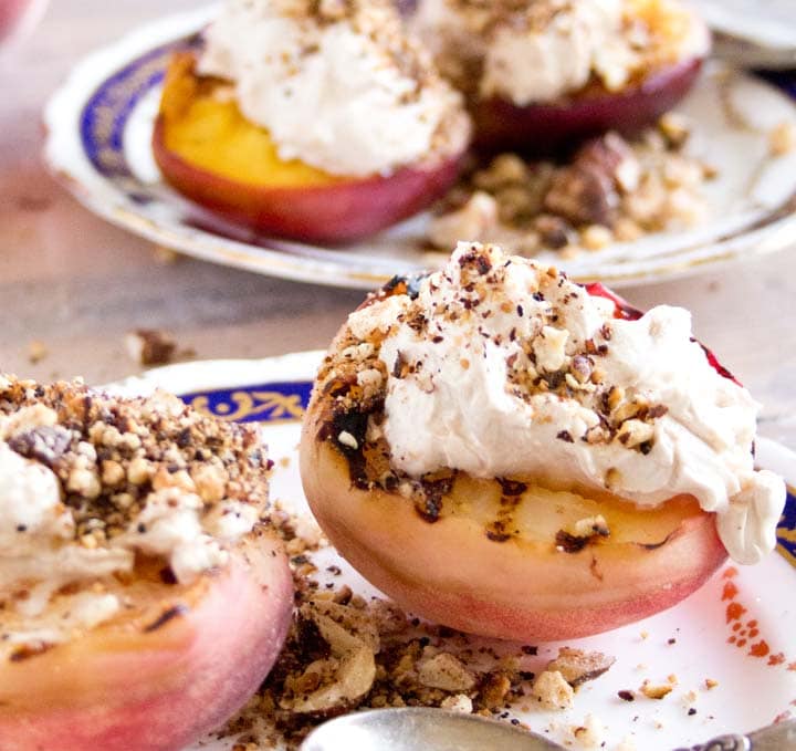 grilled peaches on a plate