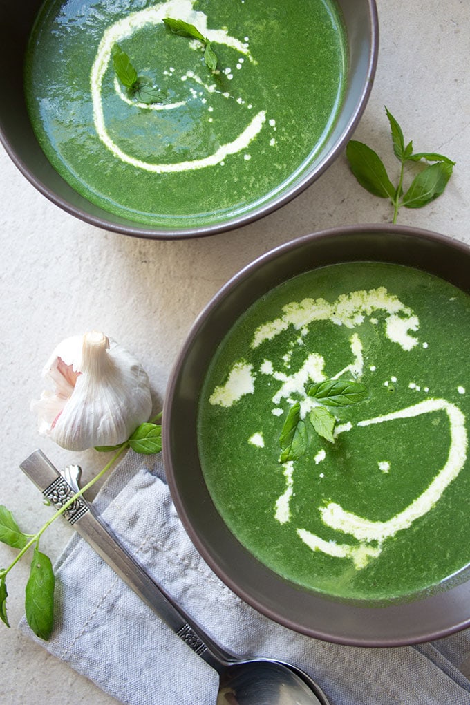 fresh spinach soup with a swirl of cream