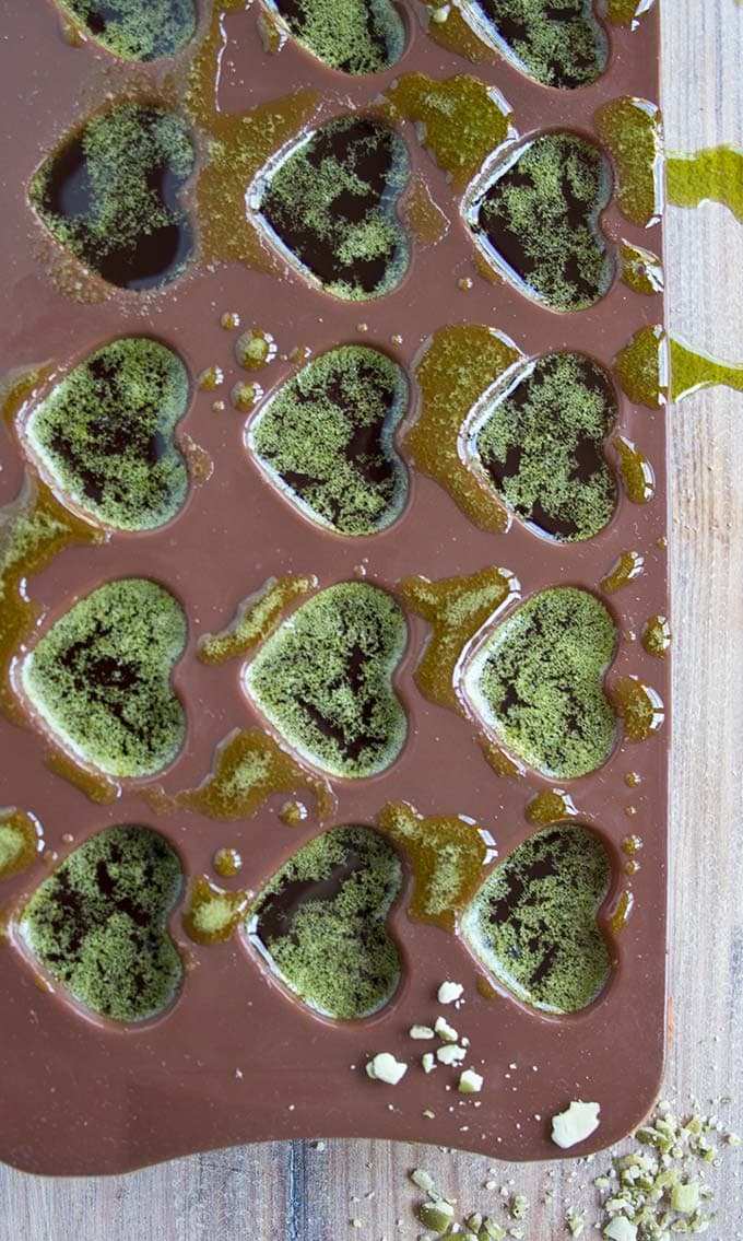 liquid matcha chocolate mix in a chocolate mould