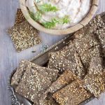 Sesame flax crackers on a tray.