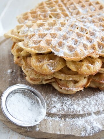 a stack of fluffy almond butter coconut flour waffles