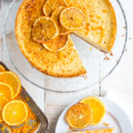 orange brandy cheesecake and a slice of cheesecake on a plate