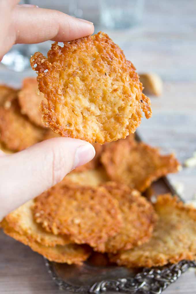 hand holding low carb cheese crisps