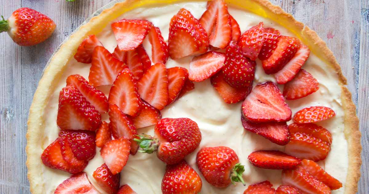 Strawberry mascarpone tart topped with sliced strawberries