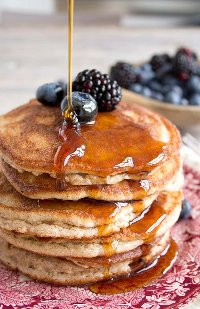 a stack of coconut flour pancakes with sugar free syrup