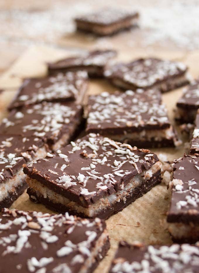 squares of coconut filled chocolate bark with coconut topping 