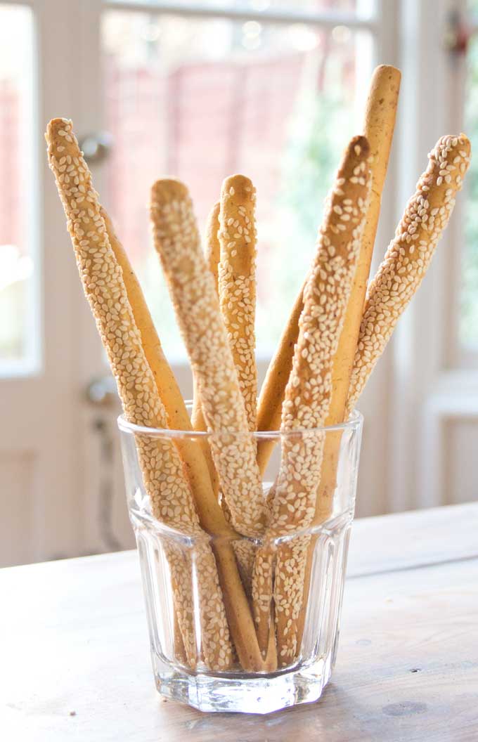 low carb cheese straws with sesame seeds in a glass