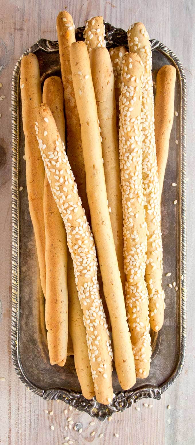 low carb cheese straws with sesame seeds on a silver tray