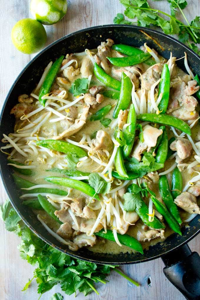 a pan with chicken green curry and coriander