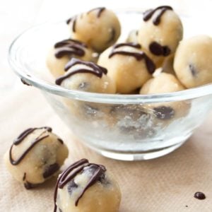 keto cookie dough balls with chocolate chips and chocolate ganache in a bowl
