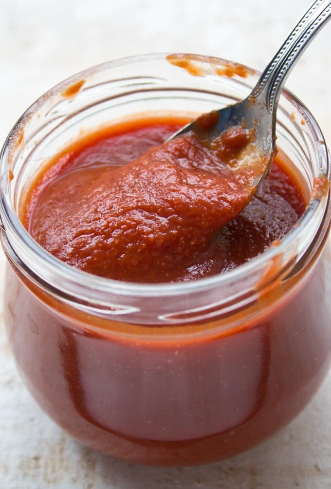 Sugar Free barbecue sauce in a glass jar with spoon