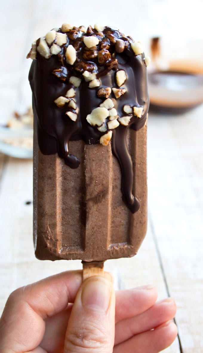 Hand holding a sugar free chocolate popsicle 