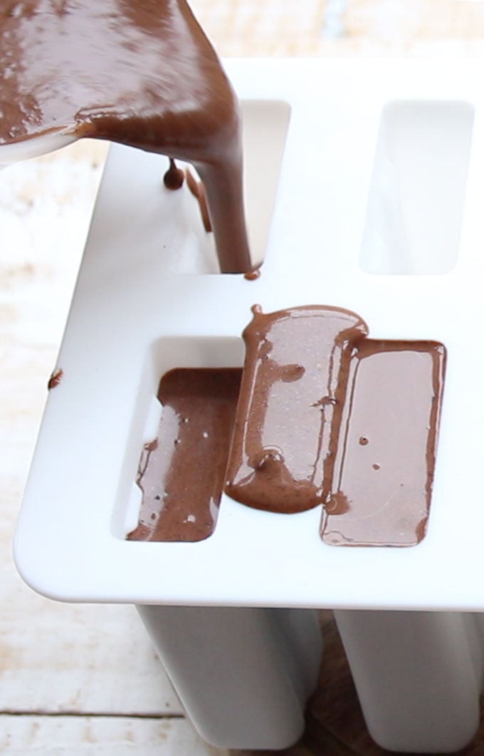 Pouring the mix for sugar free chocolate fudgesicles into a silicone mould