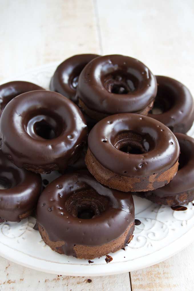 Keto chocolate donuts stacked on a plate