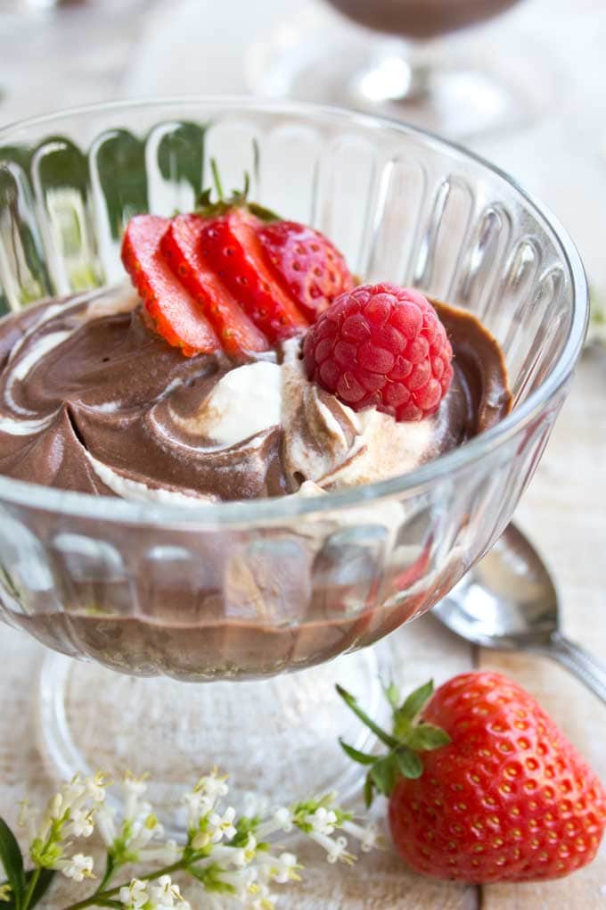 A cup with chocolate mascarpone mousse and berries
