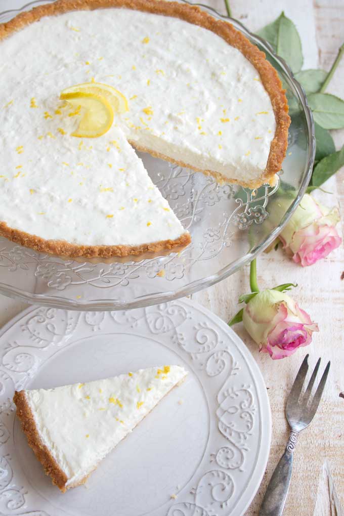 Zingy and refreshing, this low carb lemon cheesecake tart is a heavenly creamy highlight to any meal. Your family will never guess it's sugar free! Keto, gluten free and diabetic-friendly.