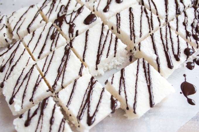 Chocolate drizzle on coconut squares