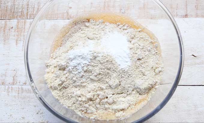 Ingredients for almond flour bread in a glass bowl