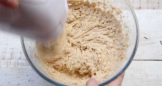 Blending bread batter in a bowl