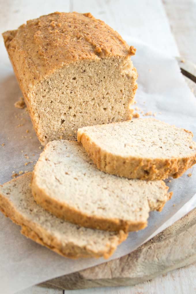 Sliced almond flour bread on a wooden board