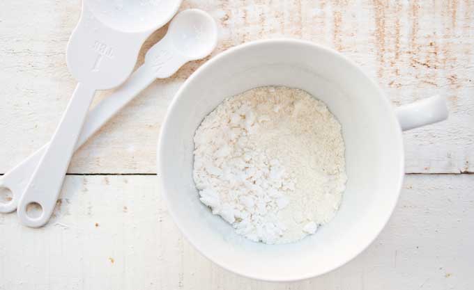 dry ingredients for a coconut flour mug cake in a mug