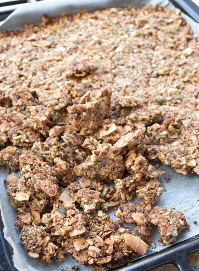 low carb granola on a baking tray broken into crunchy clusters