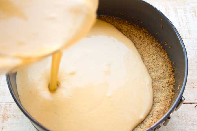 Pouring the filling onto the crust.