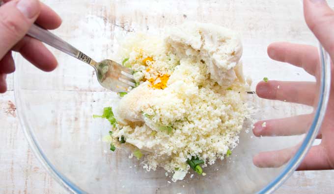 mising together dough for cauliflower fritters