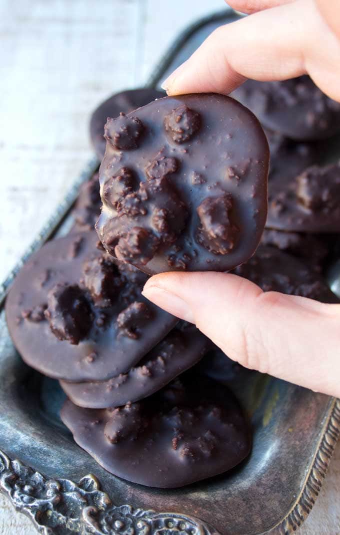 hand holding a low carb chocolate cluster