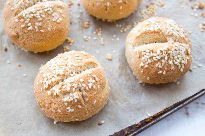 keto buns straight after baking on a parchment paper lined baking sheet