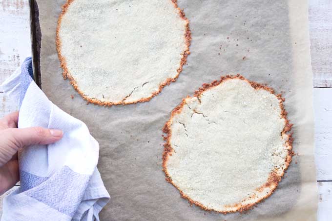 The Keto taco shells after baking on the baking sheet