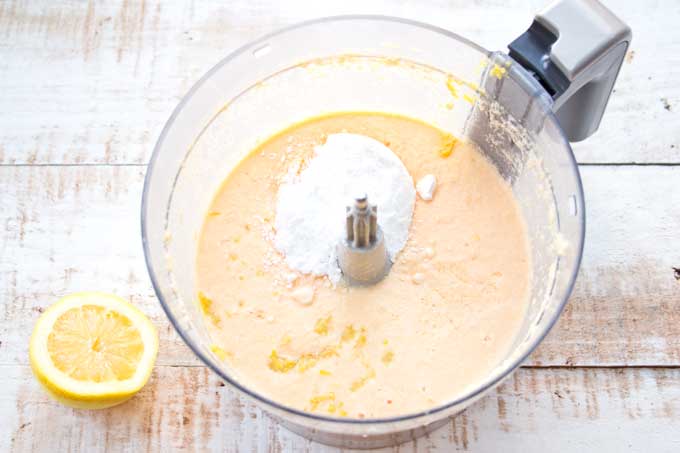 adding lemon juice and zest plus powdered erythritol to the Keto lemon bar batter