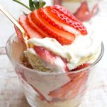 a golden spoon taking a spoonful of sugar free strawberry trifle