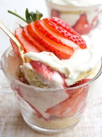 a golden spoon taking a spoonful of sugar free strawberry trifle