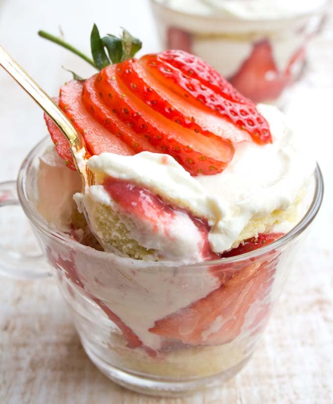 a golden spoon taking a spoonful of sugar free strawberry trifle