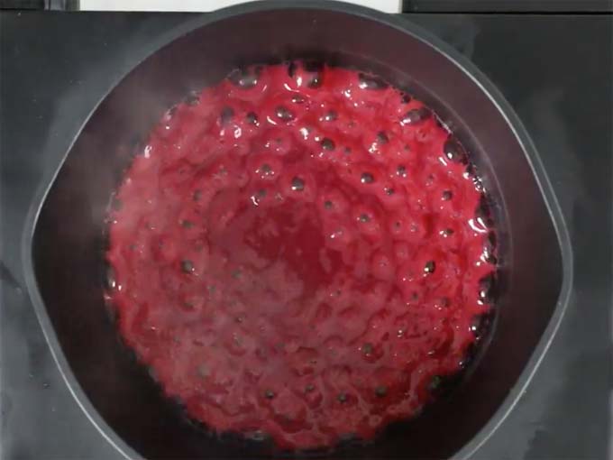 berry juice bubbling in a pan