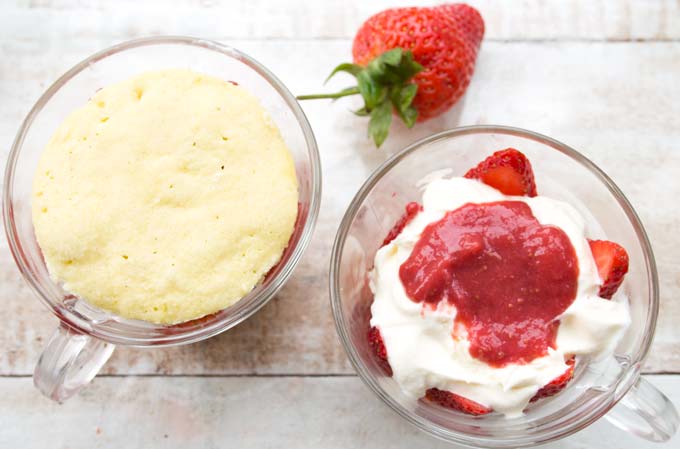 adding cream, sugar free strawberry jam and a top layer of shortcake whilst assembling a strawberry trifle