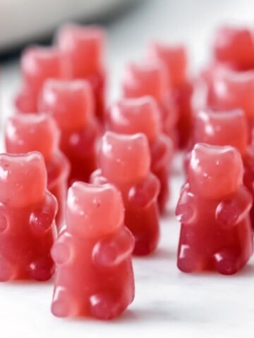 closeup of triple berry keto gummy bears lined up on a table