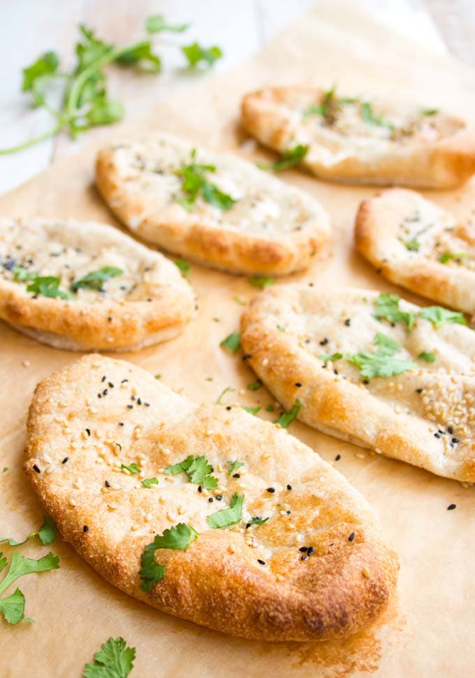 six Keto naan flatbreads topped with cilantro