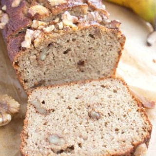 sugar free banana bread sliced and a banana in the background