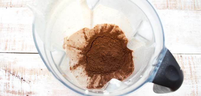 cocoa powder and peanut butter mix in a blender