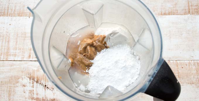 Peanut butter, sweetener and coconut milk in a blender