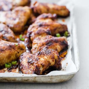 crispy baked keto chicken wings on a silver baking tray